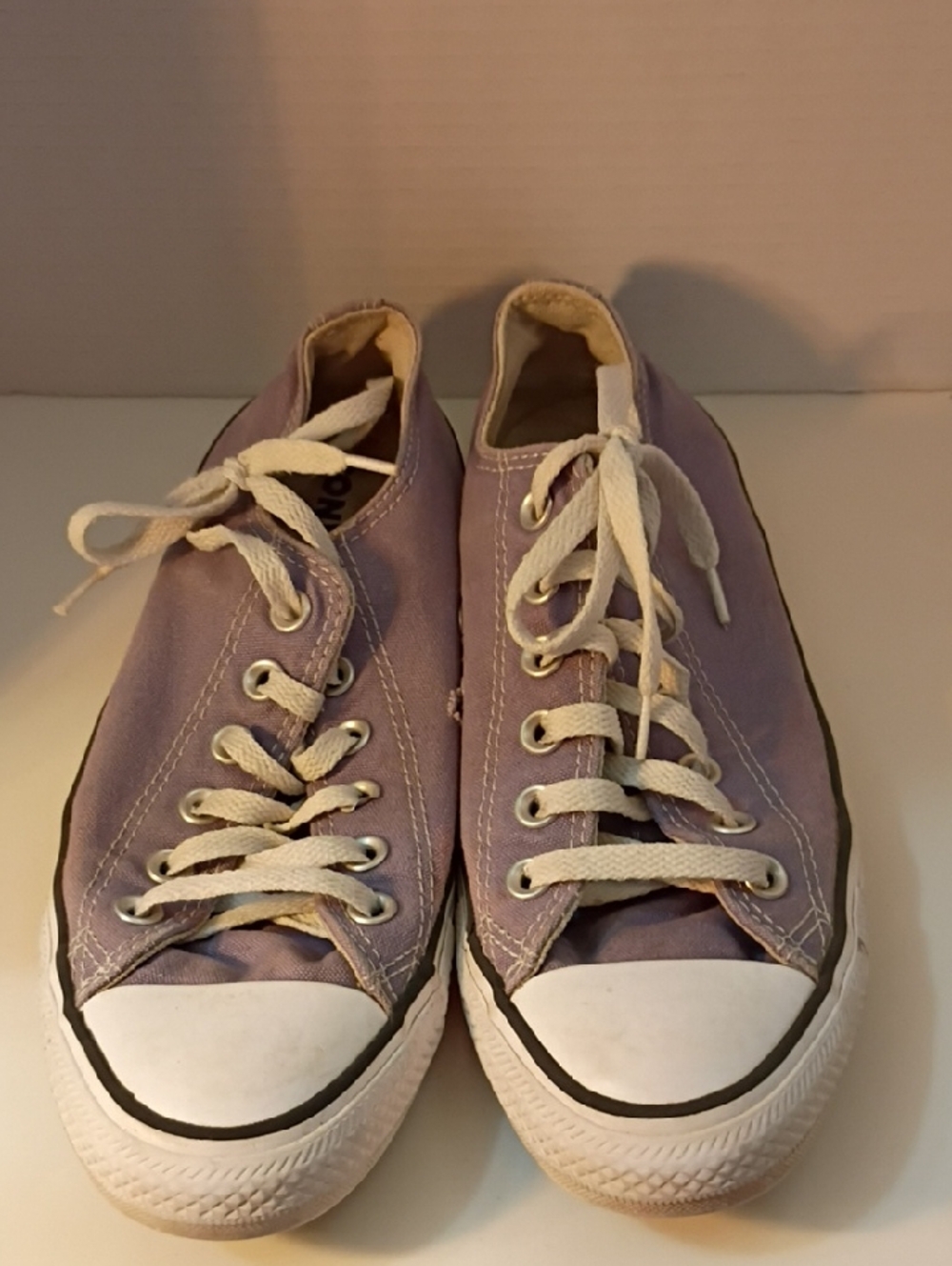 Converse Chuck Taylor All Star low-top sneakers in a purple or indigo colorway w